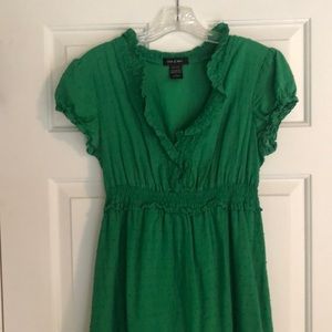 Sweet ruffled green summer dress with high waist and capped sleeves.